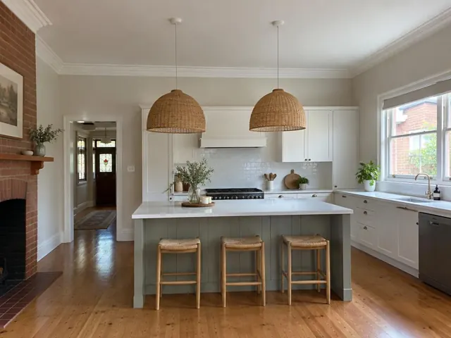 Two woven pendant lights over a white kitchen island in a bright home kitchen in Croydon