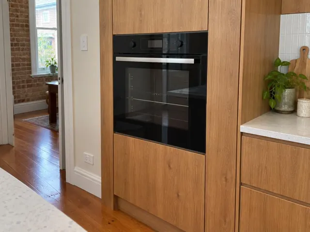 Built-in wall oven in timber kitchen cabinetry in Dulwich Hill